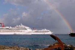beautiful rainbow shines over the Grand Cayman port after... by Andrew Kubica 